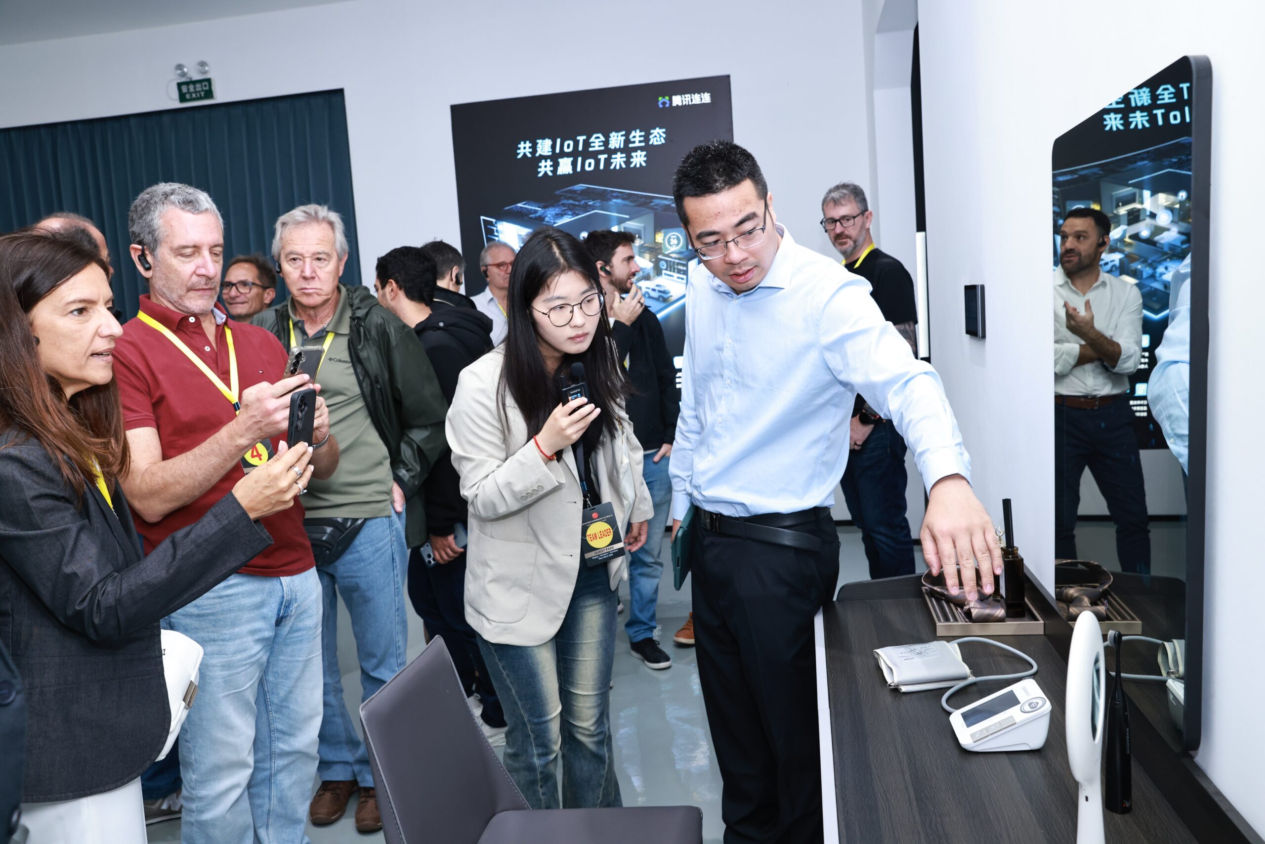 Automated production workshop in a Chinese factory visited by an international business delegation