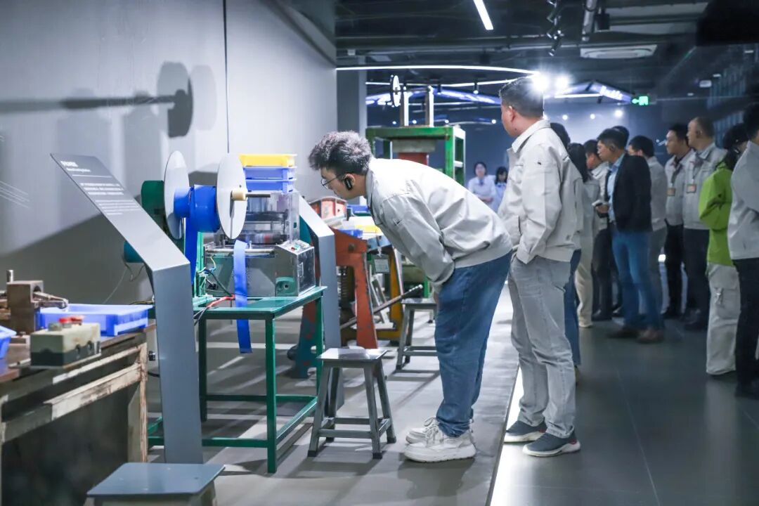 BYD Floor 4 exhibit showing the transition from consumer batteries to power batteries for electric vehicles