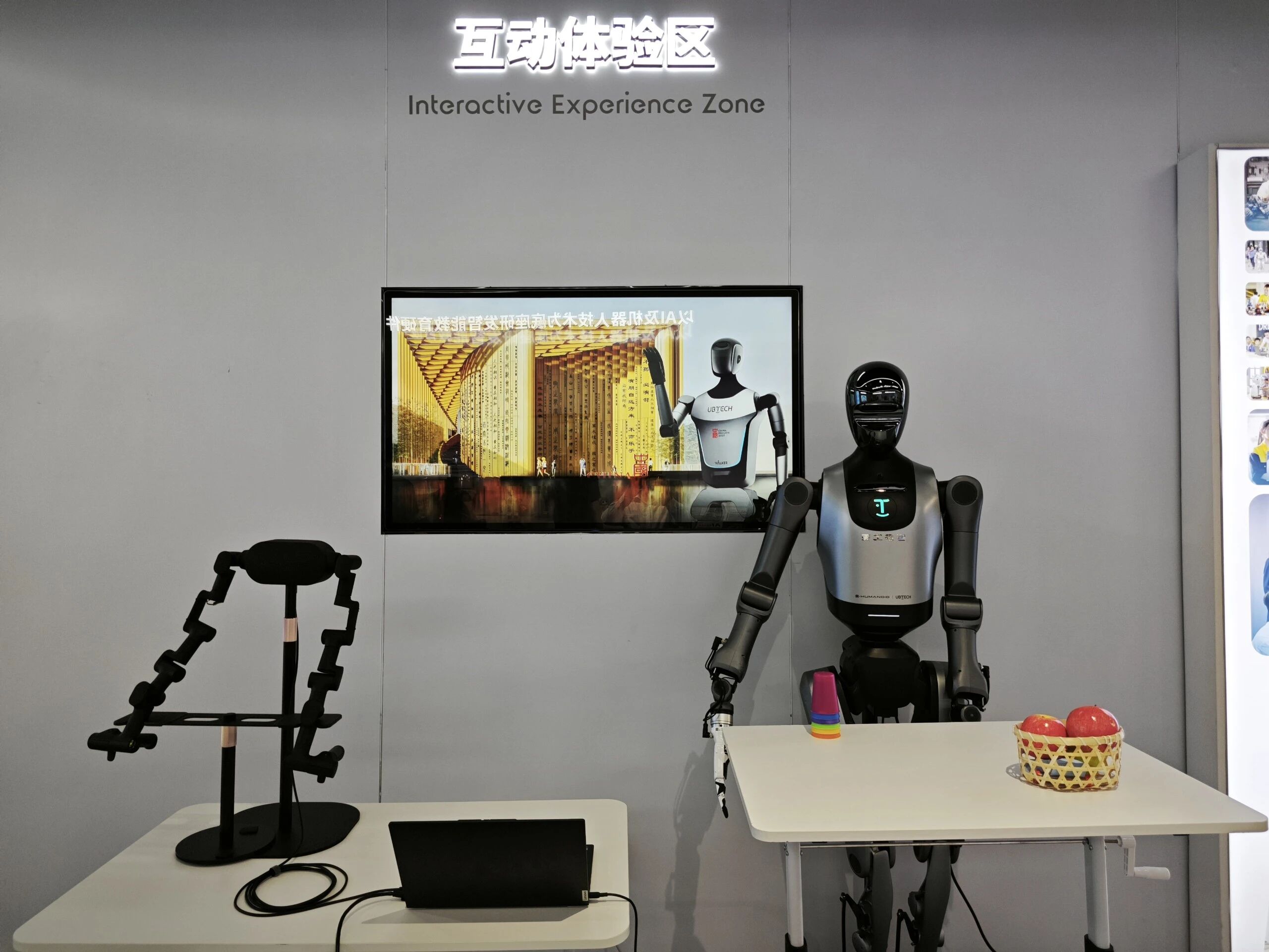 Delegates interacting with UBTECH humanoid robots in the interactive experience zone
