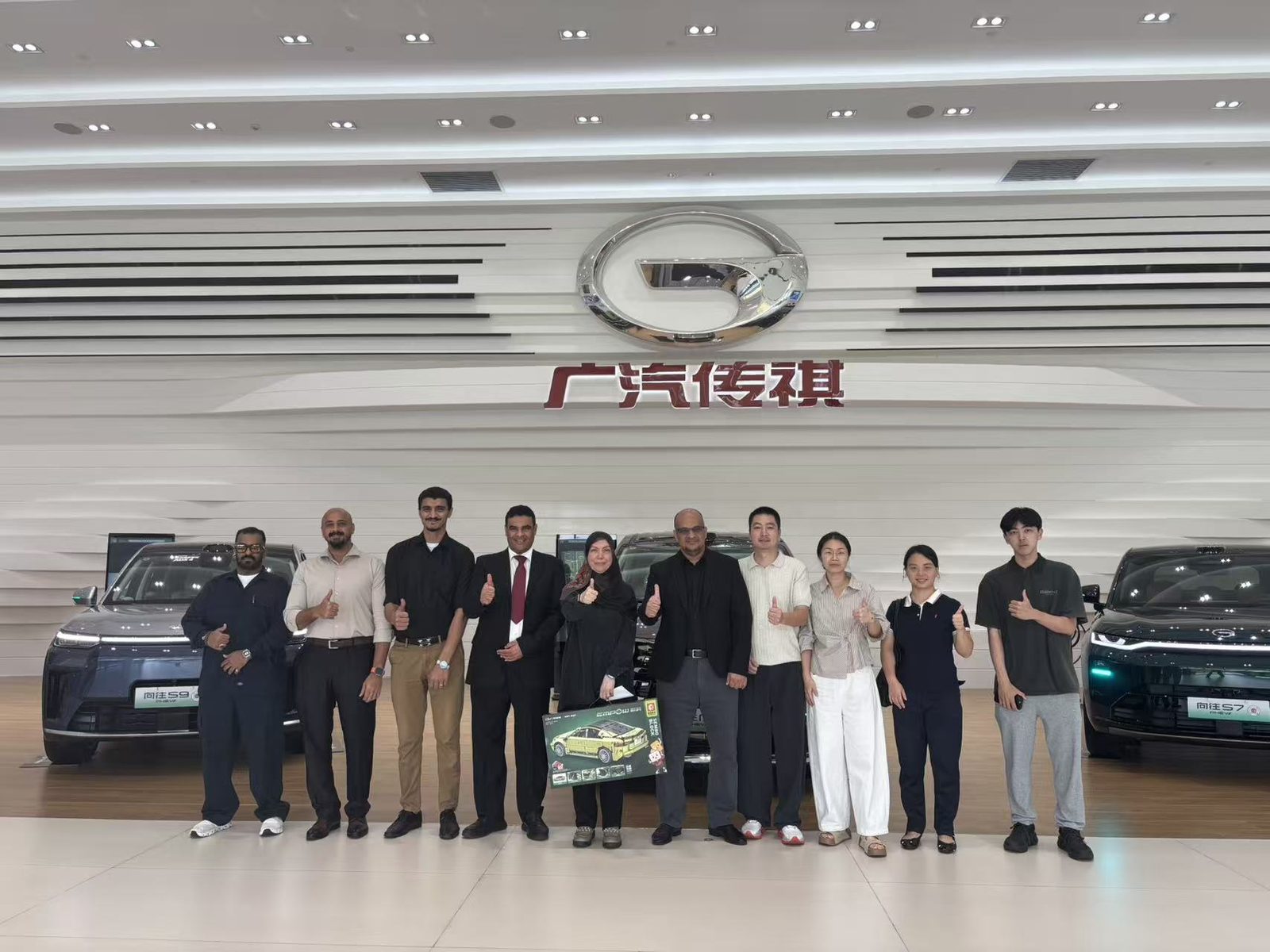 Delegation and CST team group photo at the GAC Trumpchi showroom